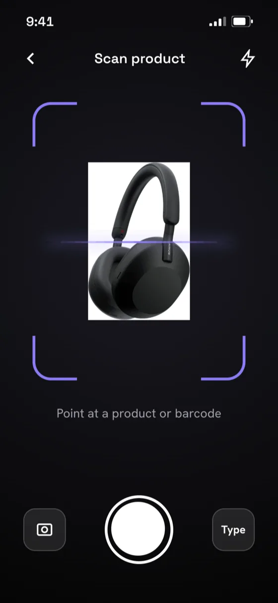 WorthIt scan screen: a camera viewfinder framing a pair of Sony headphones, captioned Point at a product or barcode, with a shutter button.